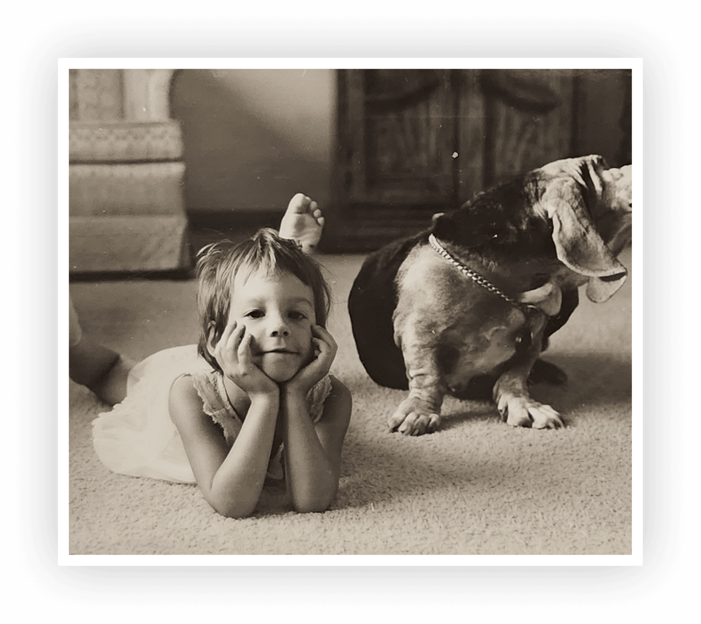 Girl and basset hound relaxing indoors