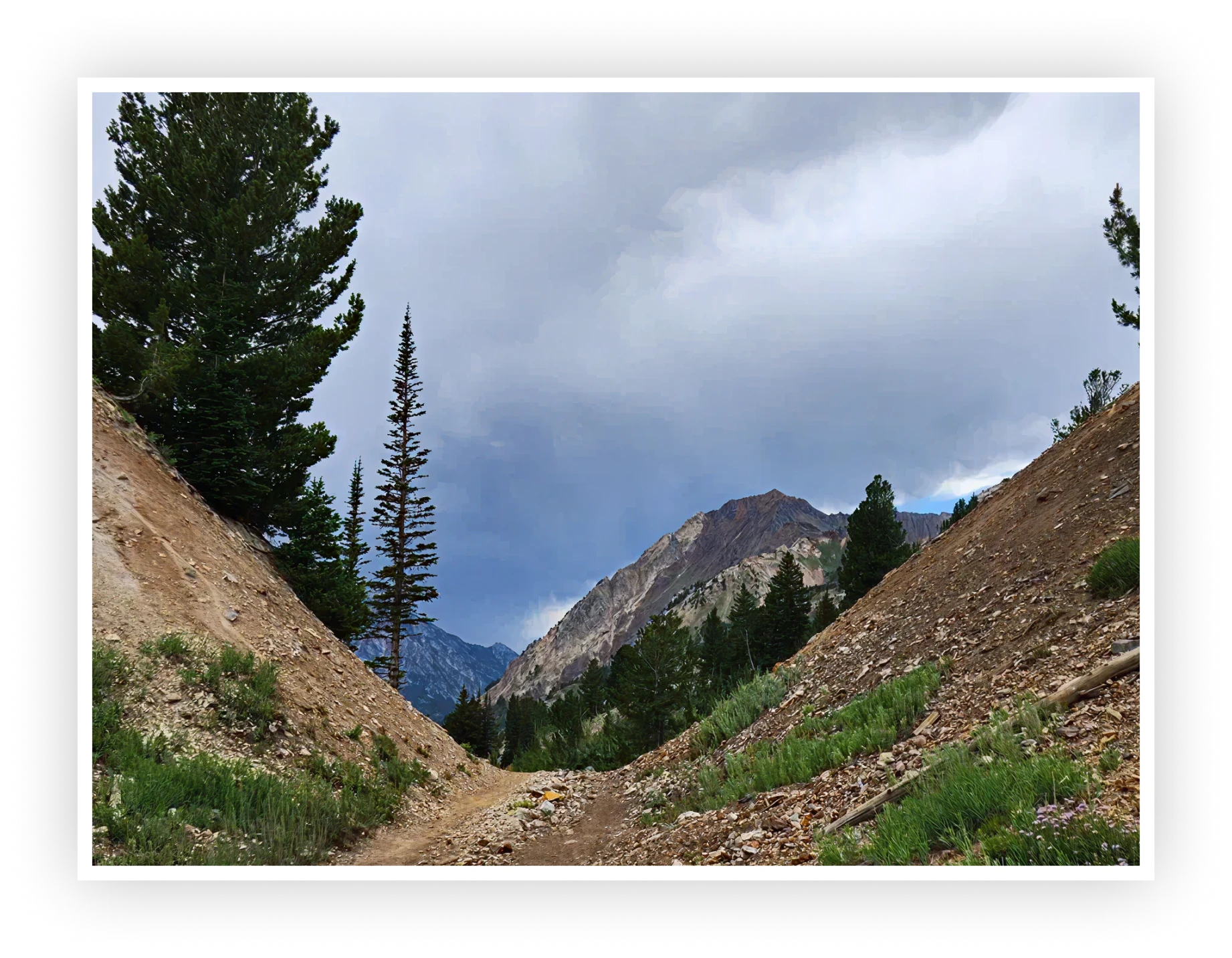 Mountain path with cloudy sky
